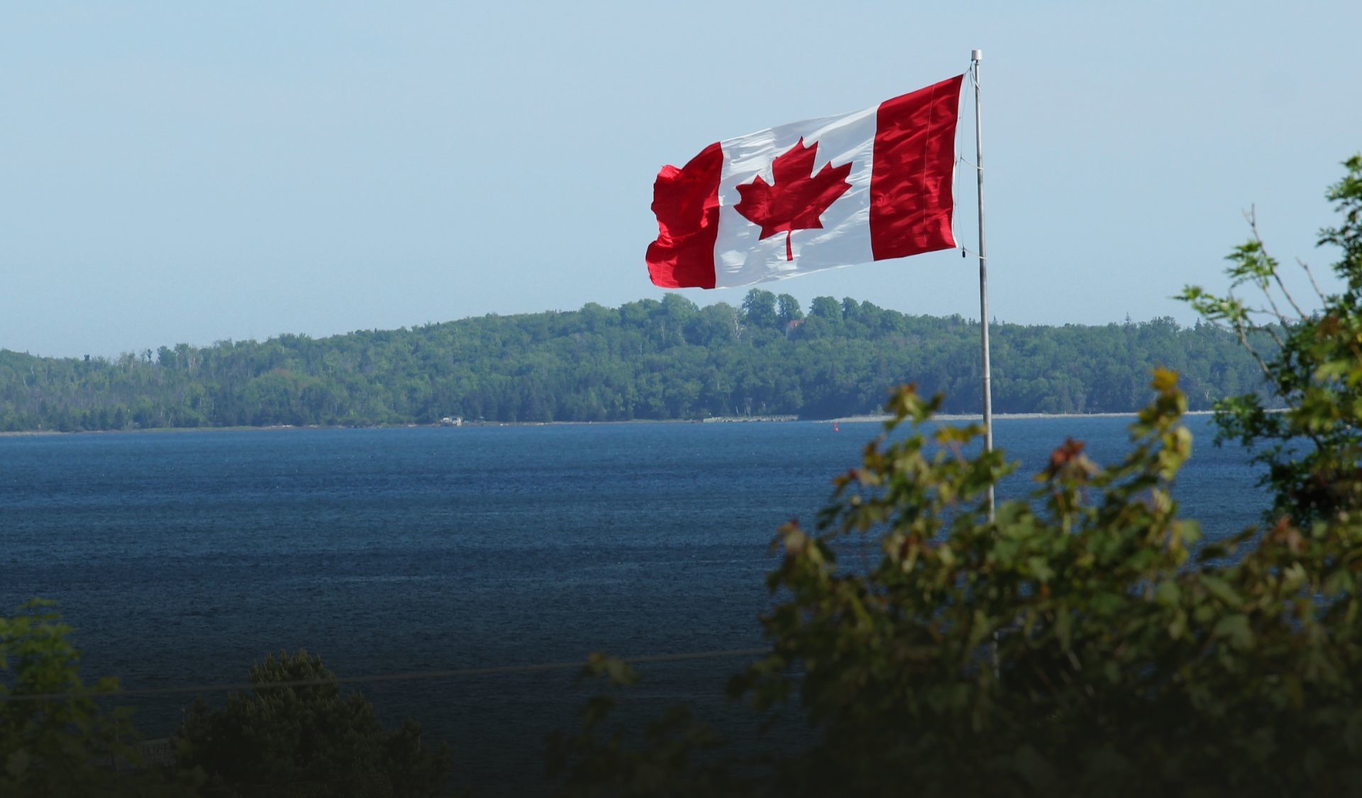 Canadian Flag with Lake in background